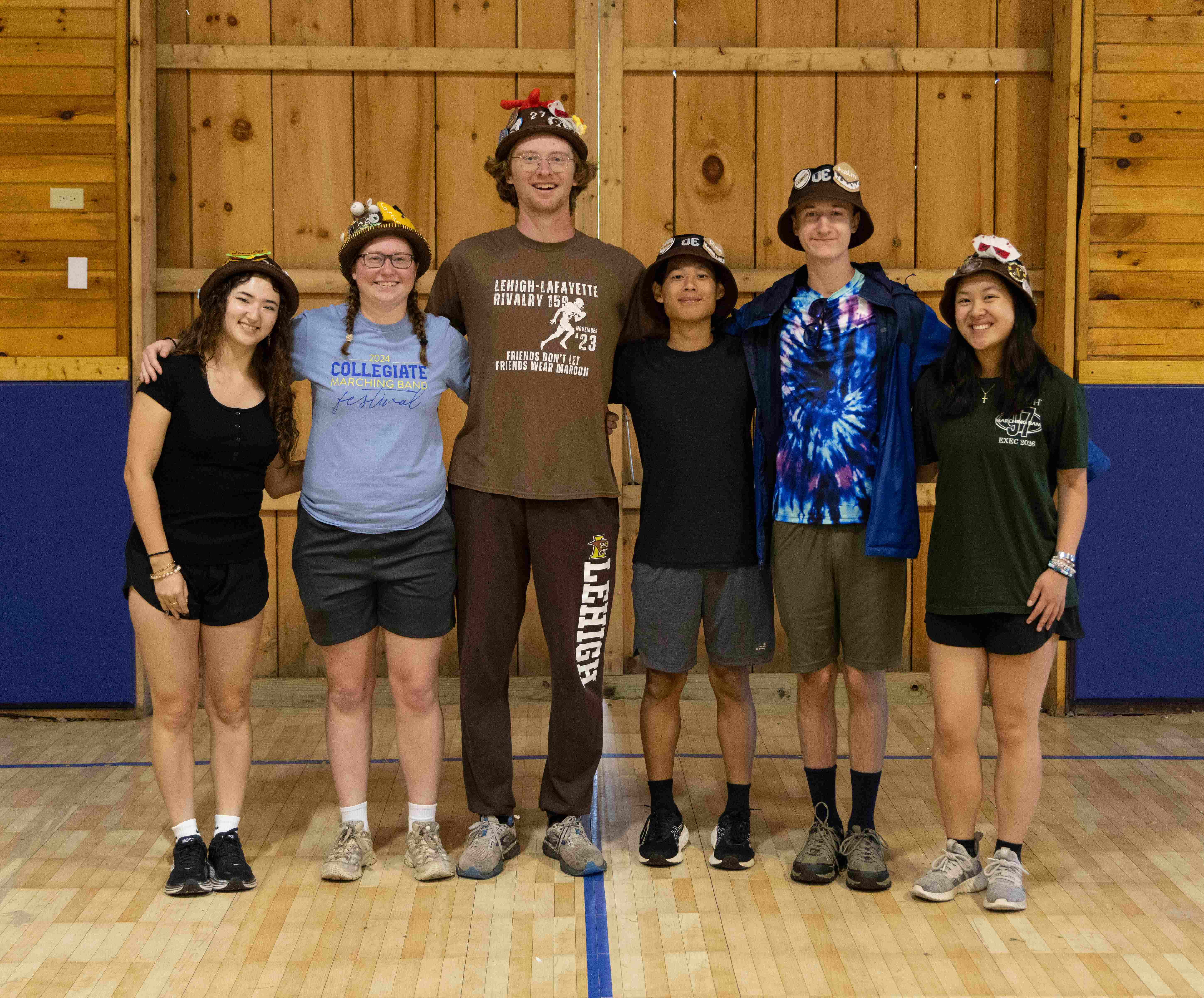 Rank 14 smiling with their arms around each other at band camp.