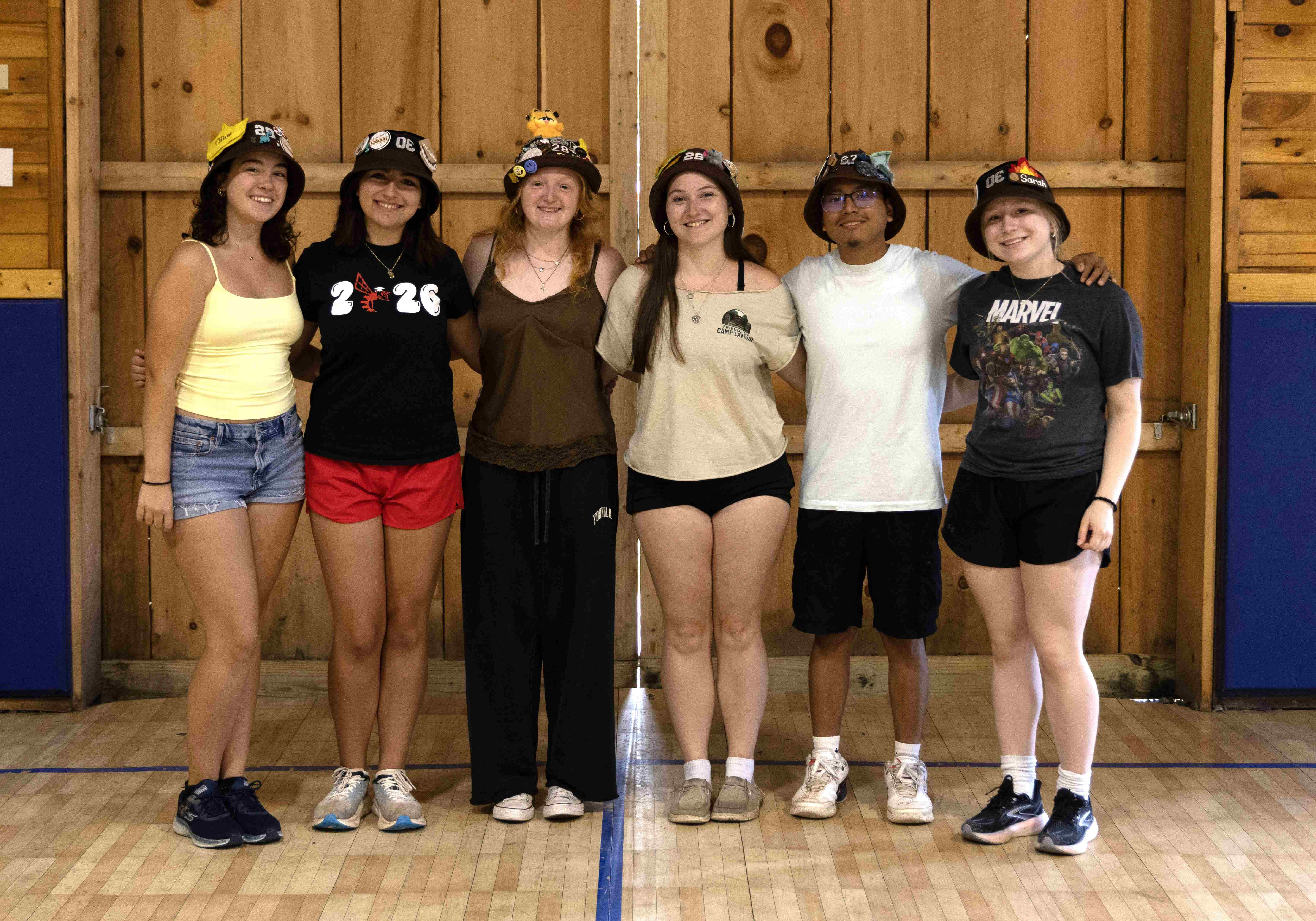 Rank 2 smiling with their arms around each other at band camp.