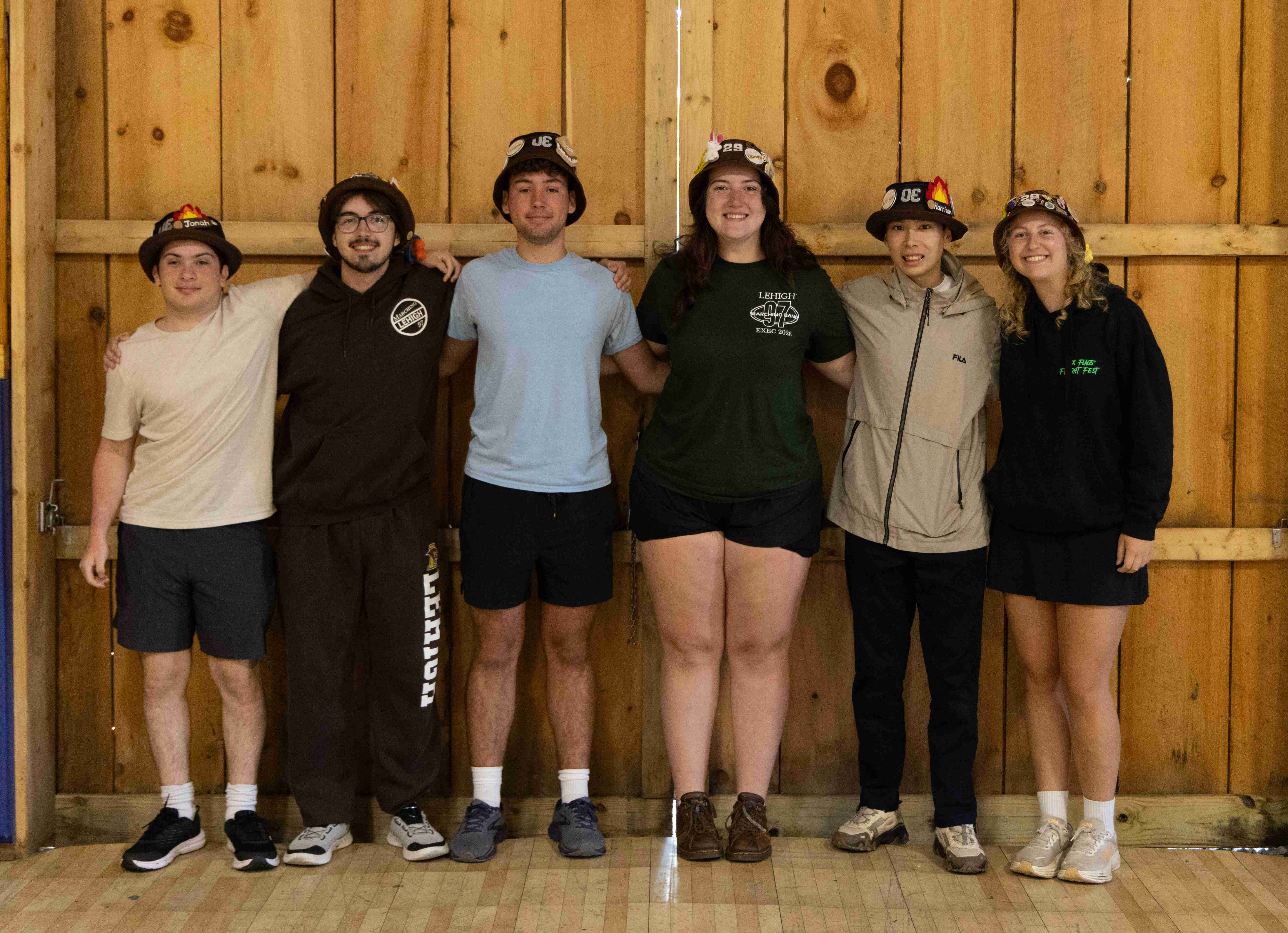 Rank 7 smiling with their arms around each other.