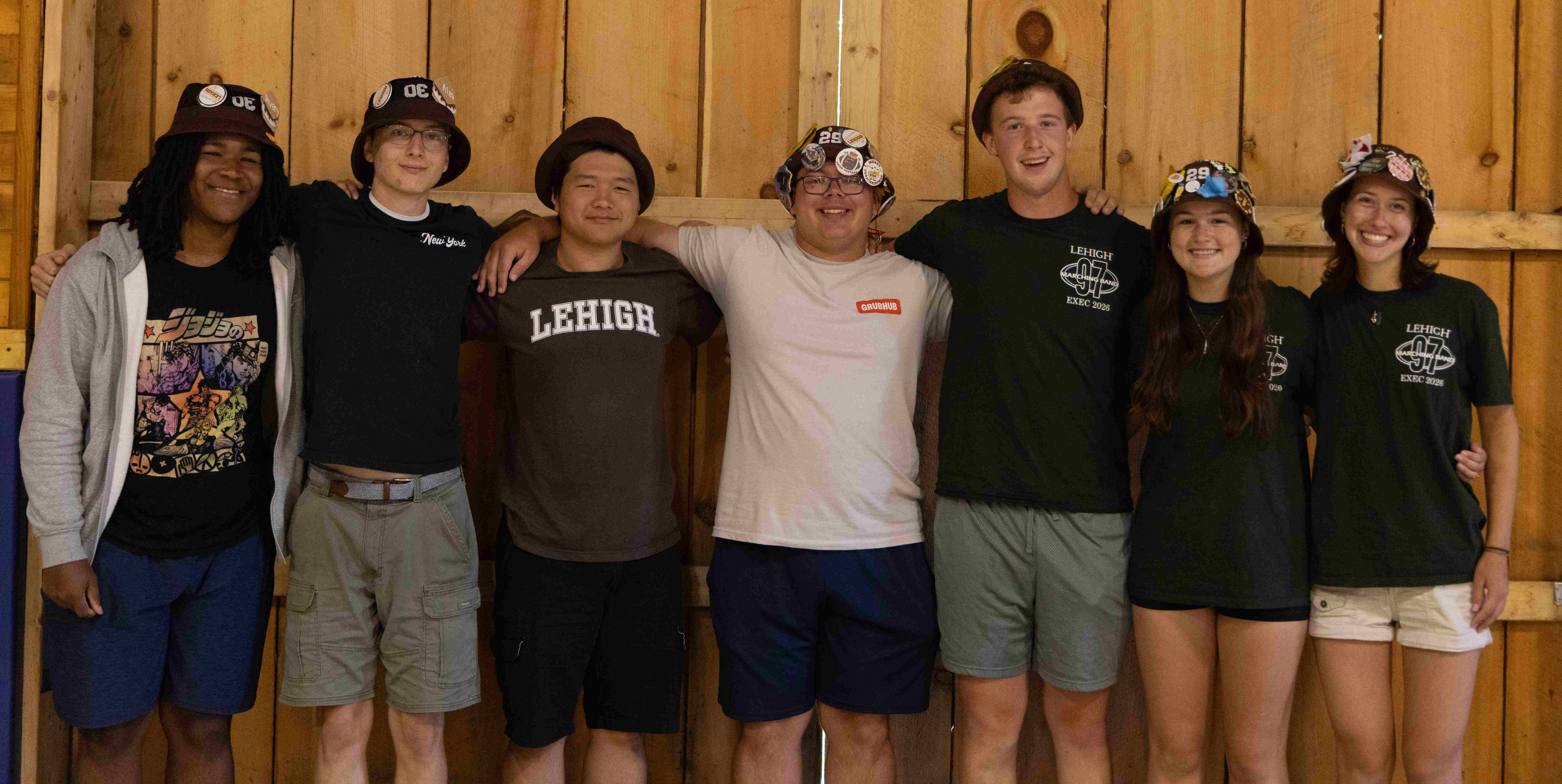 Rank 8 smiling with their arms around each other at band camp.